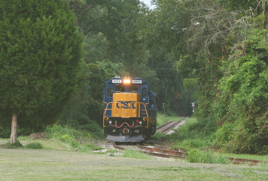 M740 heading for the mine at the end of the tunnel of trees